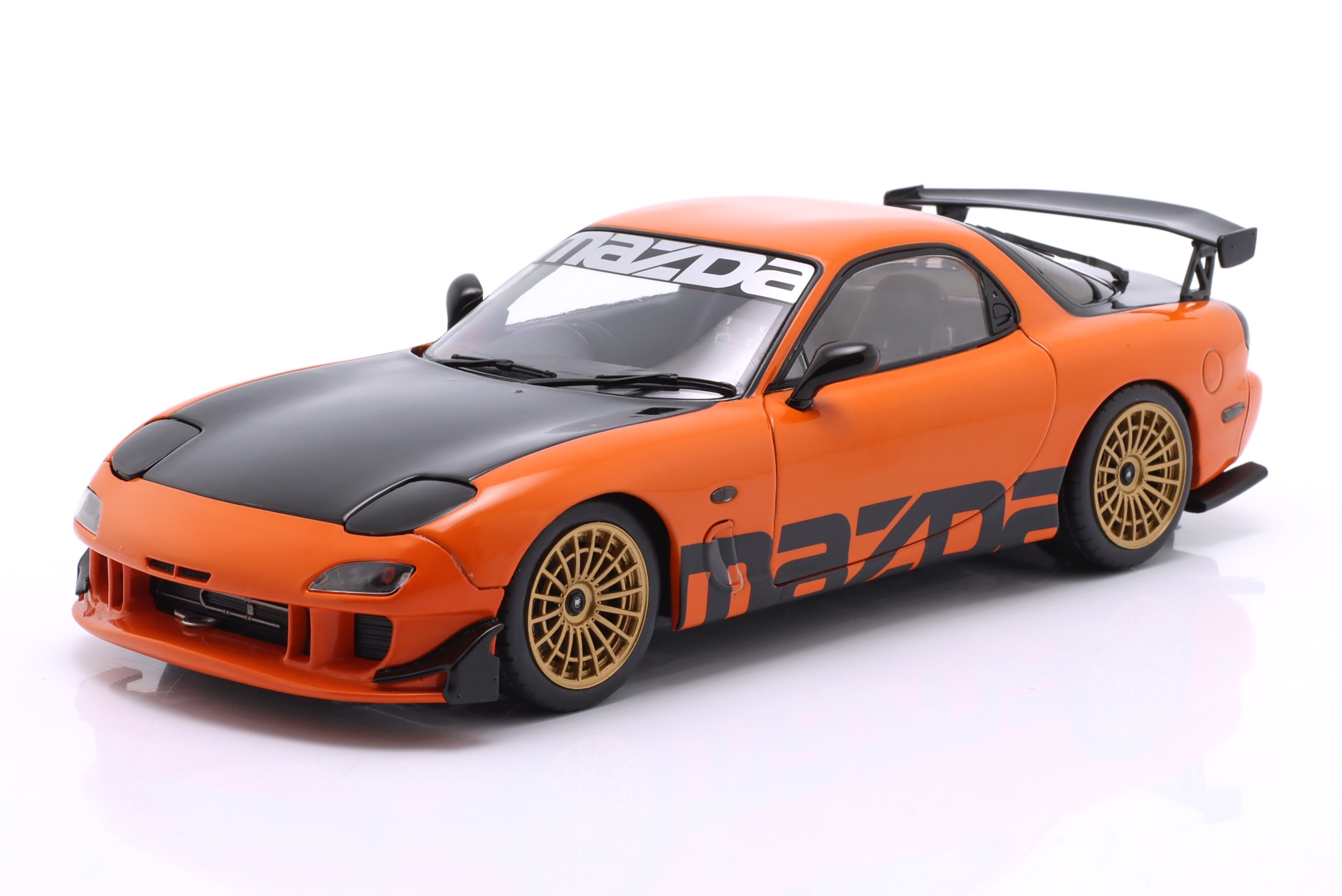 Mazda RX-7 Typ RS (FD3S) Baujahr 1999 orange / schwarz  