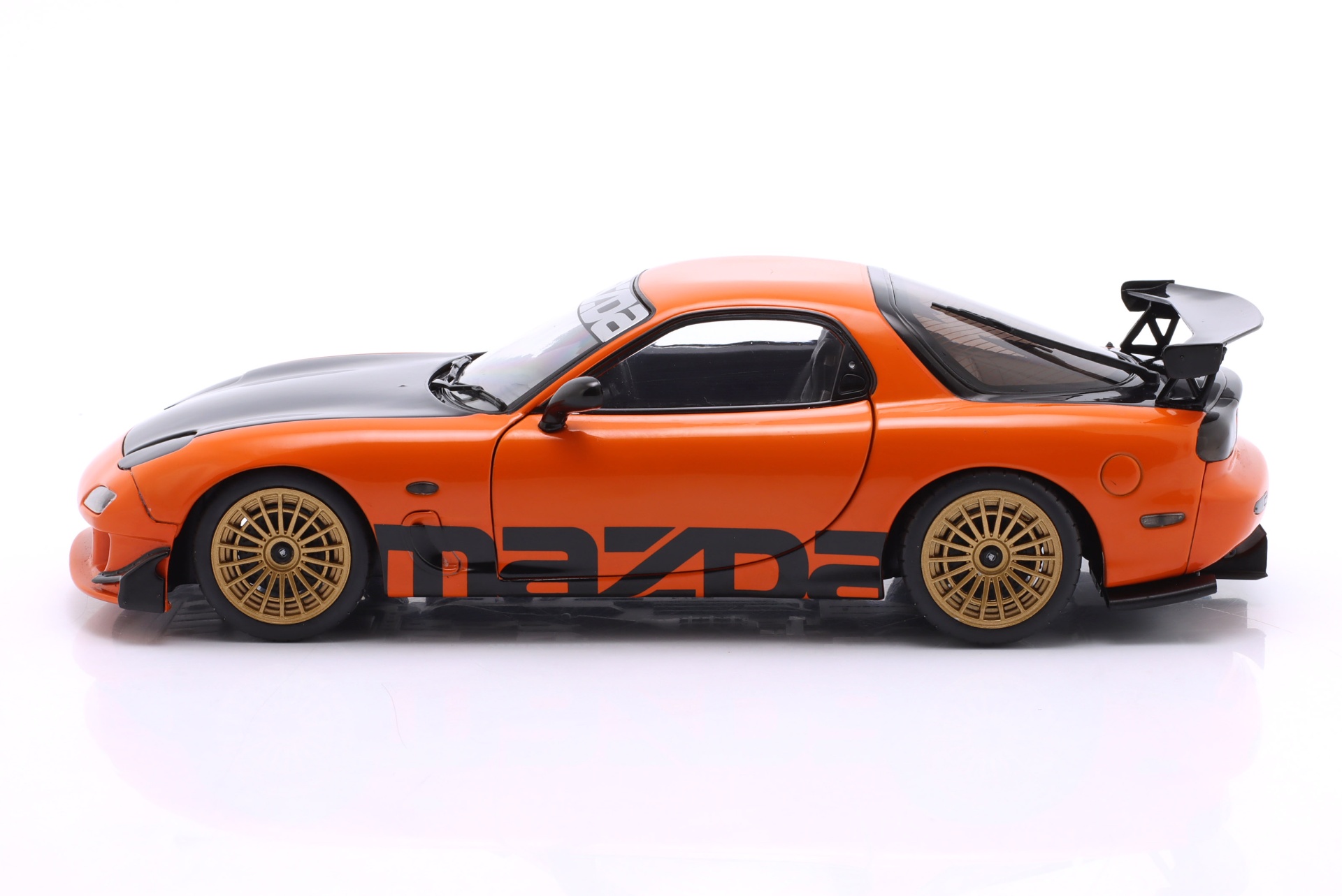Mazda RX-7 Typ RS (FD3S) Baujahr 1999 orange / schwarz  