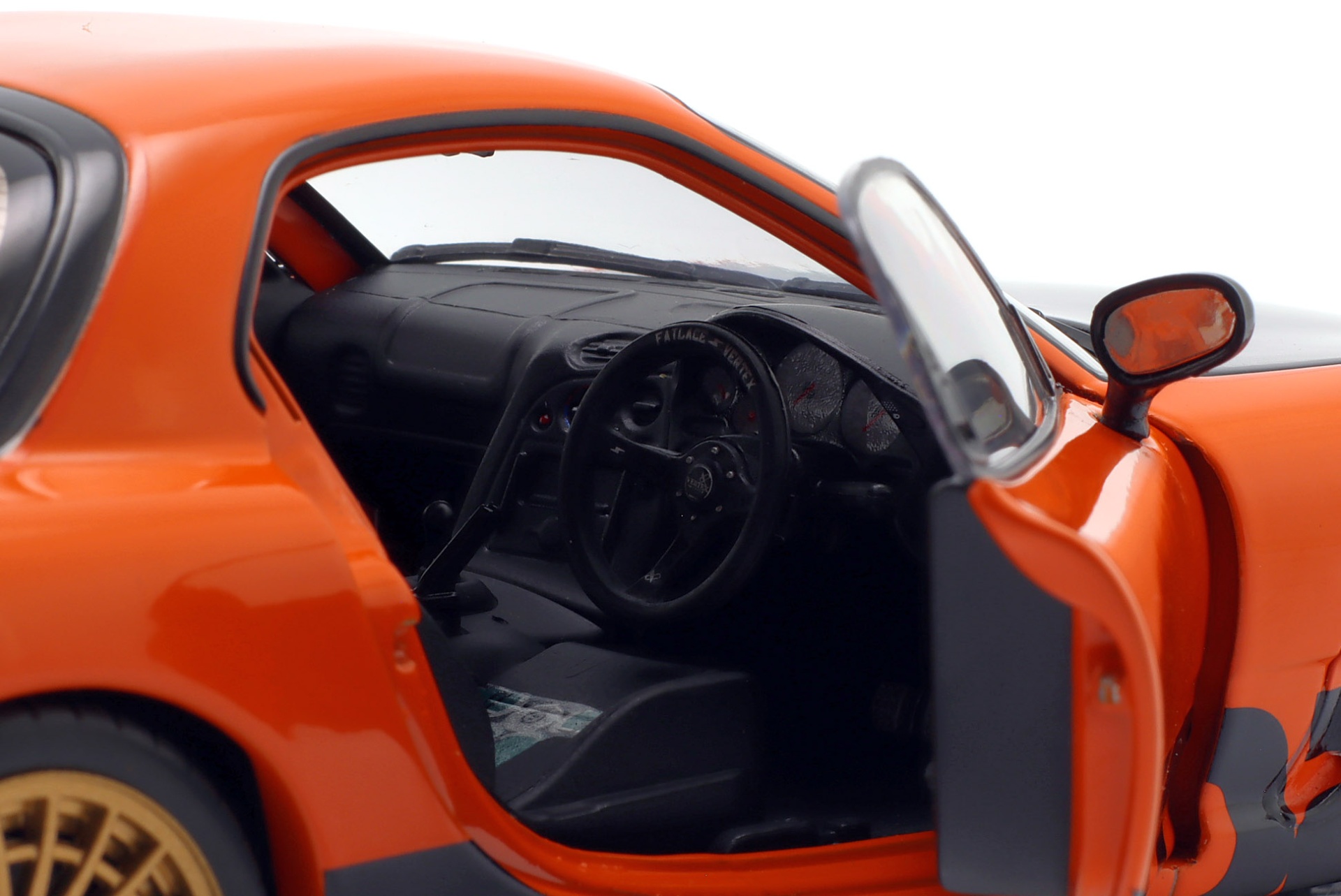 Mazda RX-7 Typ RS (FD3S) Baujahr 1999 orange / schwarz  